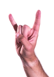 A hand making the horns sign.
