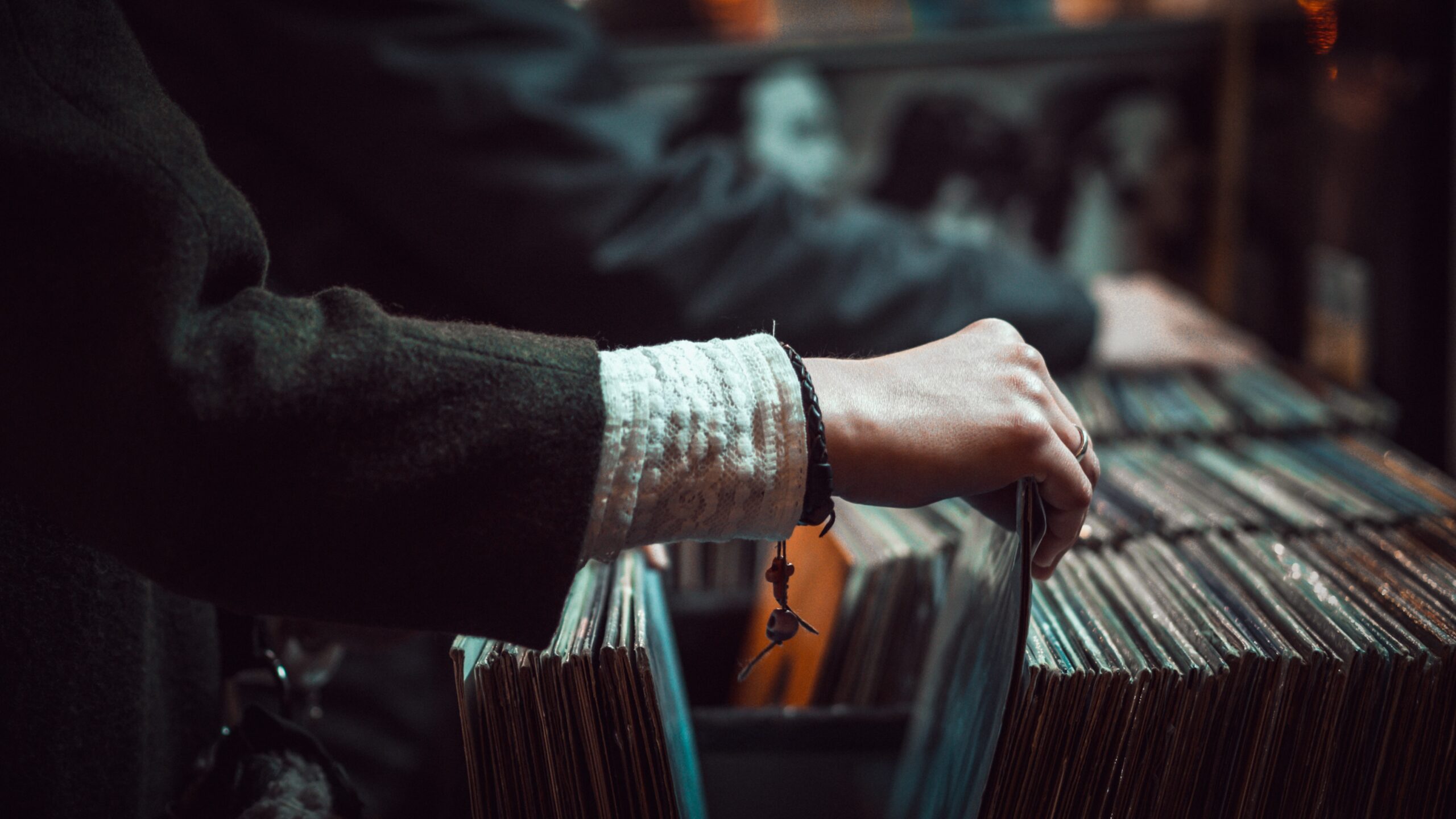 A person looking through records in a shop
